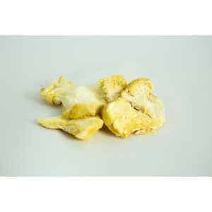 Slices of Freeze-Dried Mushroom Lion’s Mane displayed on a plain white background.