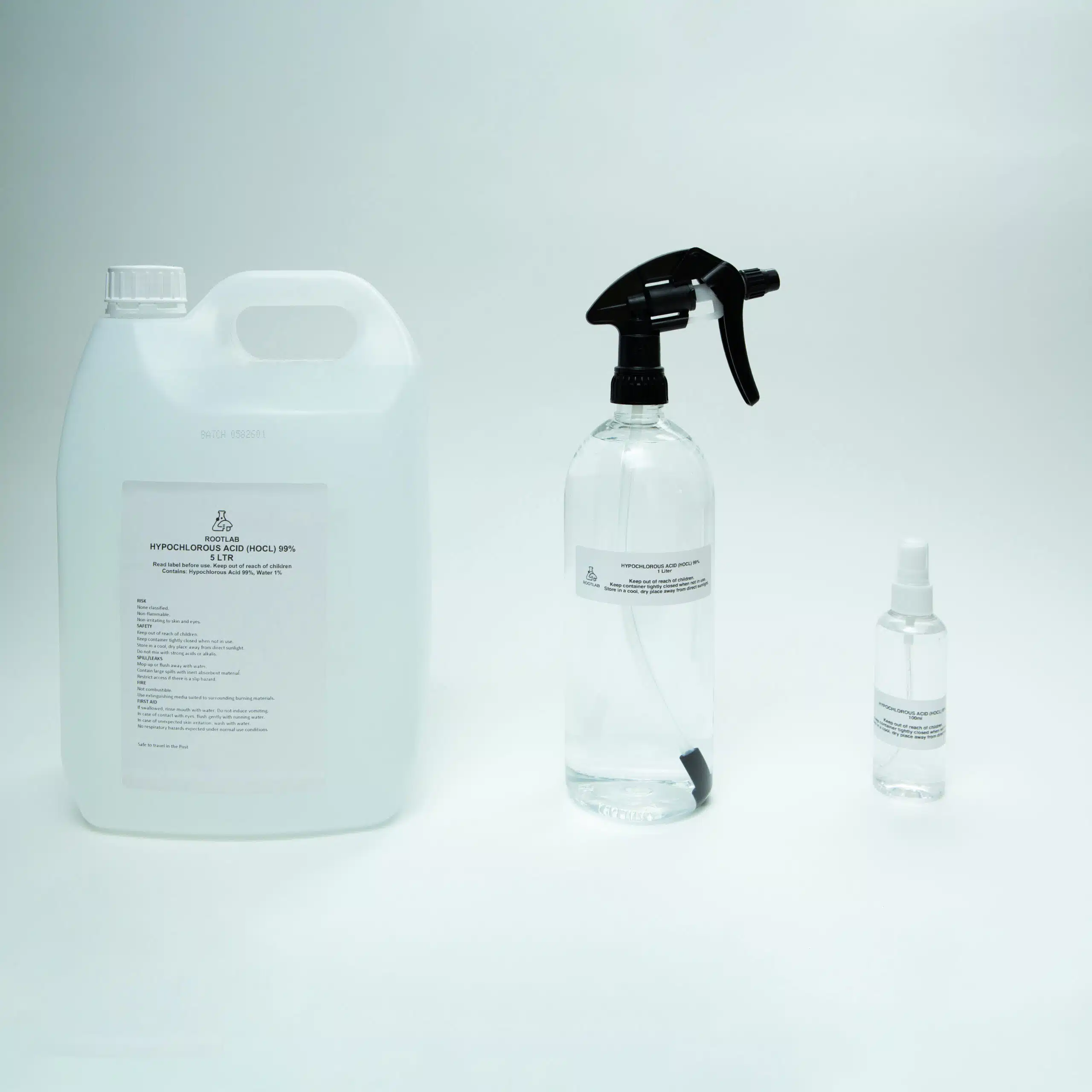 Hypochlorous Acid (HOCL) | PPM 40 1 Three clear bottles of varying sizes with white labels, containing Hypochlorous Acid (HOCL) | PPM 40 for cleaning, displayed on a plain white background.