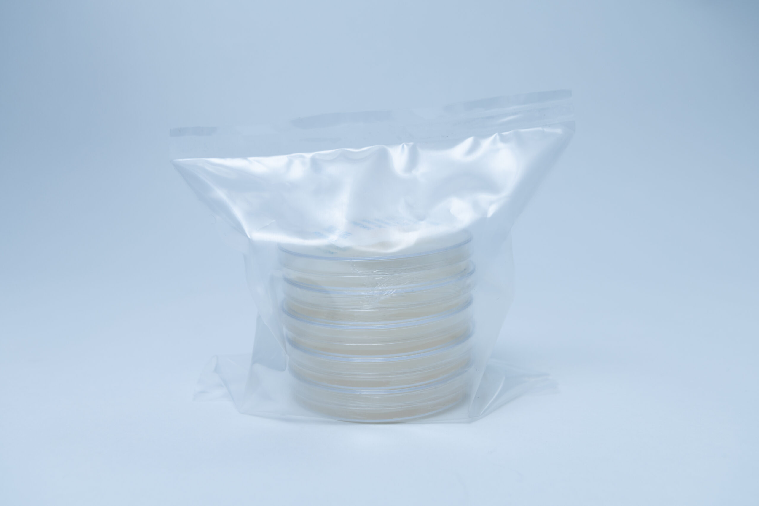 Sterile Water Agar Petri Dishes (WA) 90mm 7 A stack of petri dishes sealed in a transparent plastic bag, set against a plain light background.