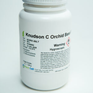 A white plastic bottle labelled Knudson C Orchid Base with warning text and storage instructions.