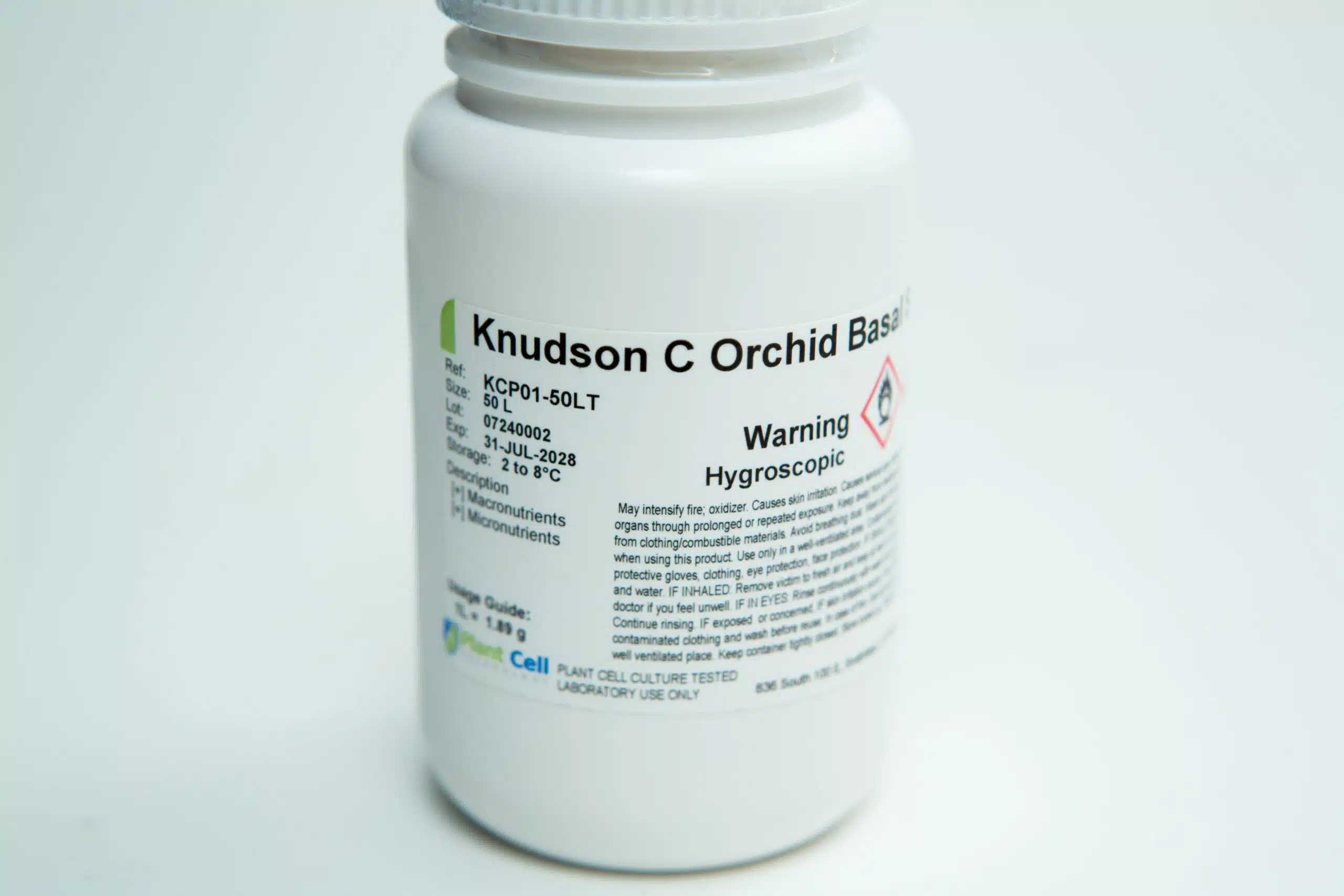 Plant Cell Knudson C Orchid Basal Salts - Orchid Germination Media | Makes 10L 1 A white plastic bottle labelled Knudson C Orchid Base with warning text and storage instructions.