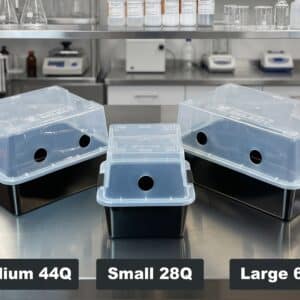 Three black containers labelled Small 28L, Medium 44L, and Large 66L sit on a lab table with clear lids.