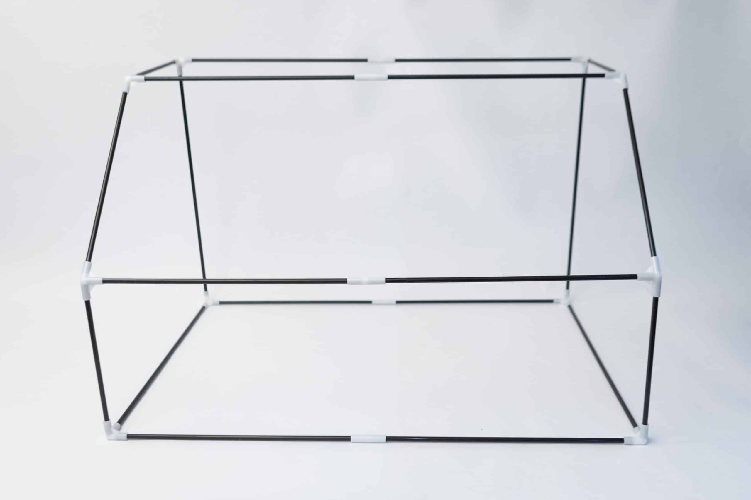 Rootlab Still Air Box with viewing Window Angled 6 A wireframe cuboid structure composed of thin rods joined at the corners, set against a white background, reminiscent of the Rootlab Still Air Box with Viewing Window Angled.