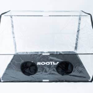 Home 18 The Rootlab Still Air Box with Viewing Window Angled features clear plastic construction, two circular openings, a convenient viewing window, and ROOTLA branding on its black base. It’s perfect for use as a still air box or Rootlab environment for your plants.