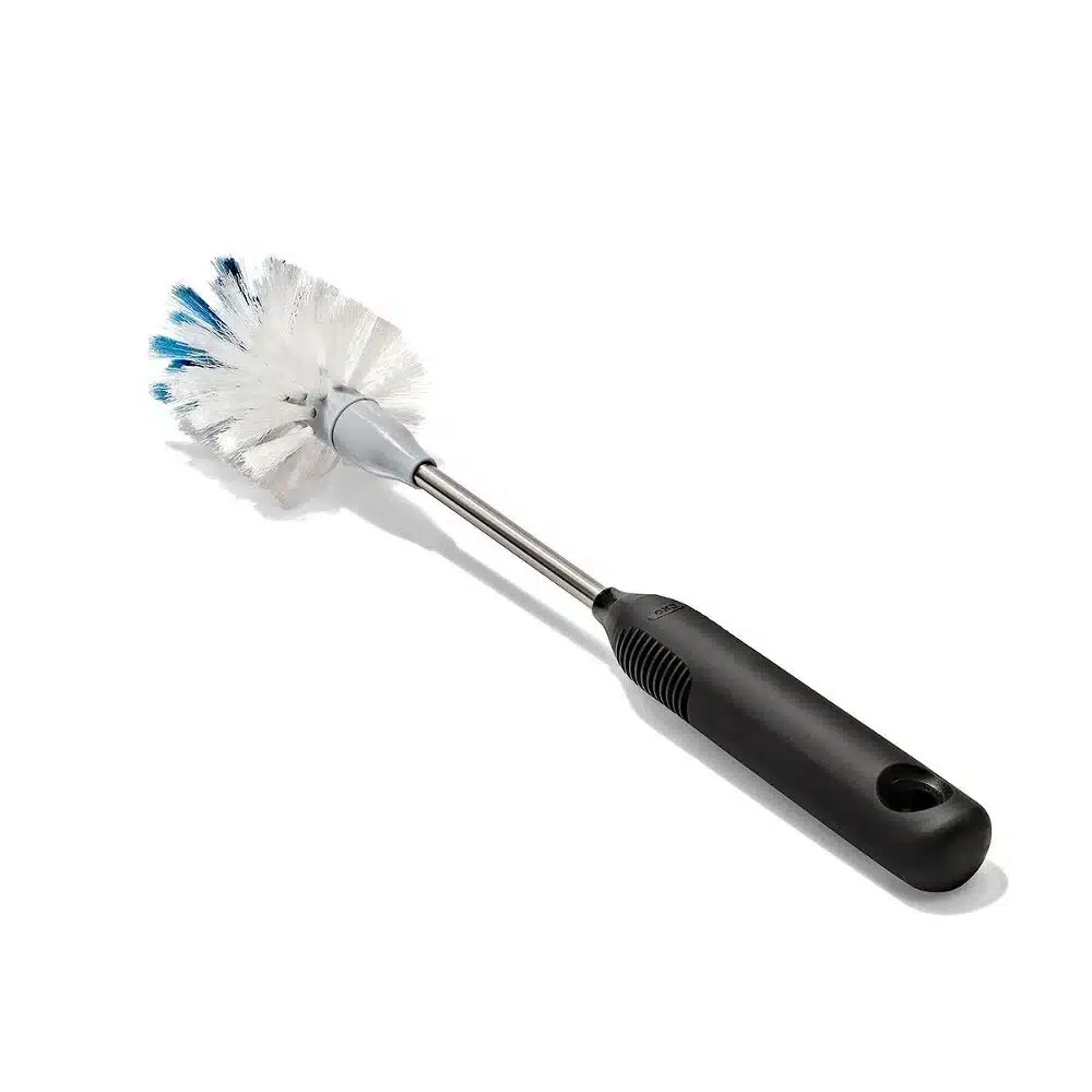 OXO Good Grip Stainless Steel Bottle Brush with replaceable head 2 Bottle brush with white and blue bristles, black handle, and metal neck on a white background.