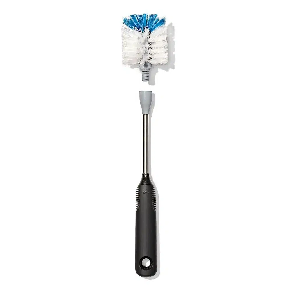 OXO Good Grip Stainless Steel Bottle Brush with replaceable head 3 Black-handled bottle brush with white and blue bristles, shown against a white background.
